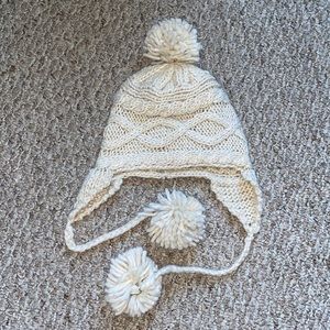 Knit winter hat with pom poms
